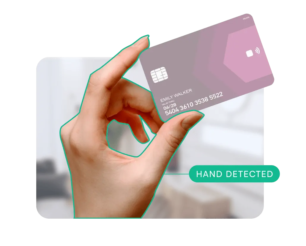 Hand holding a credit card with a marked hand, indicating the 'Hand detected' feedback message.
