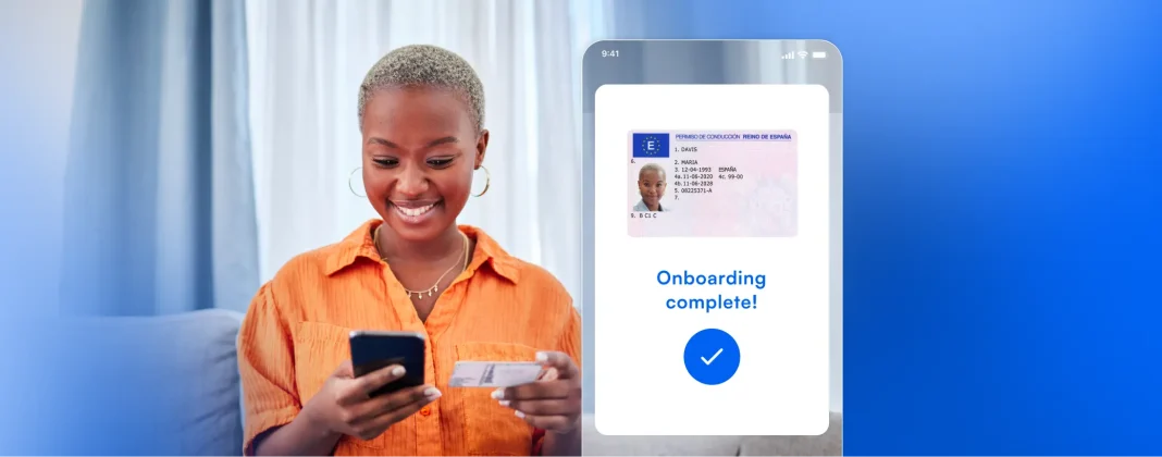 User holding a phone with a message displaying 'Onboarding Complete'.