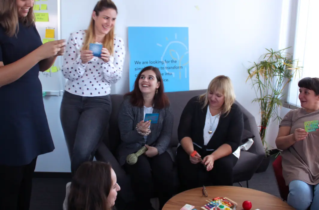 Image showing the Human Resources team socializing in a break room.